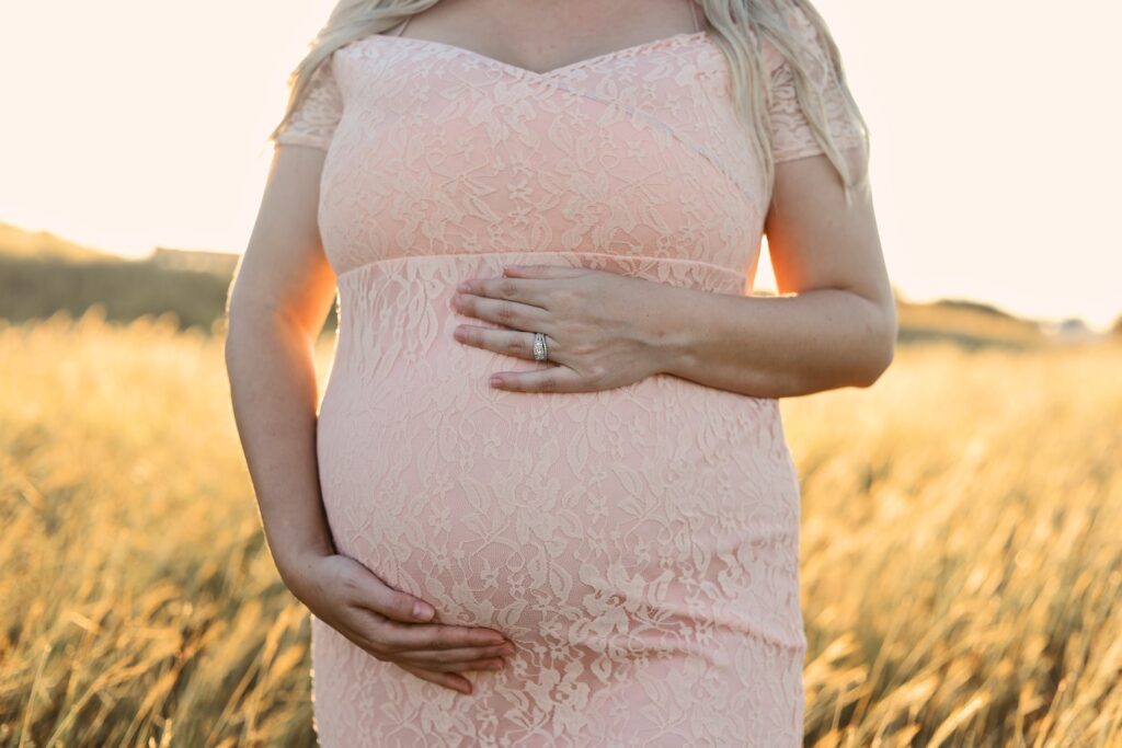 pregnant woman wearing pink dress